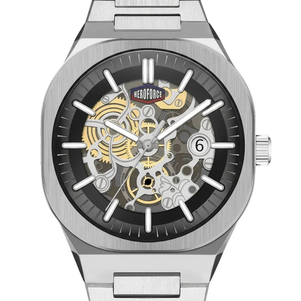 A silver stainless steel skeleton wristwatch with a black dial, showing gold and silver mechanical gears through the case.