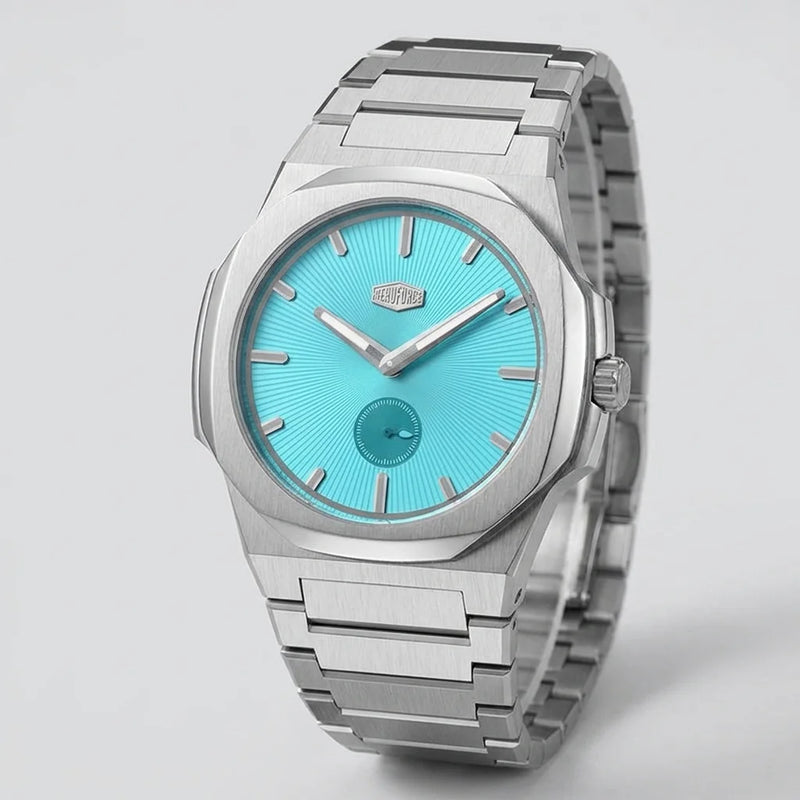 Full frontal view - Stainless steel wristwatch with turquoise sunburst dial, silver markers, and small seconds subdial