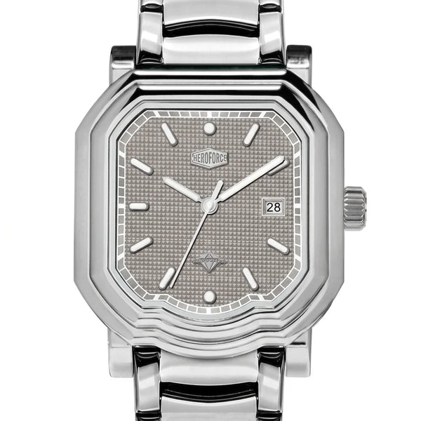 Upclose view - Silver wristwatch with octagonal rectangular case, metallic bracelet, gray textured dial, silver markers, and date window