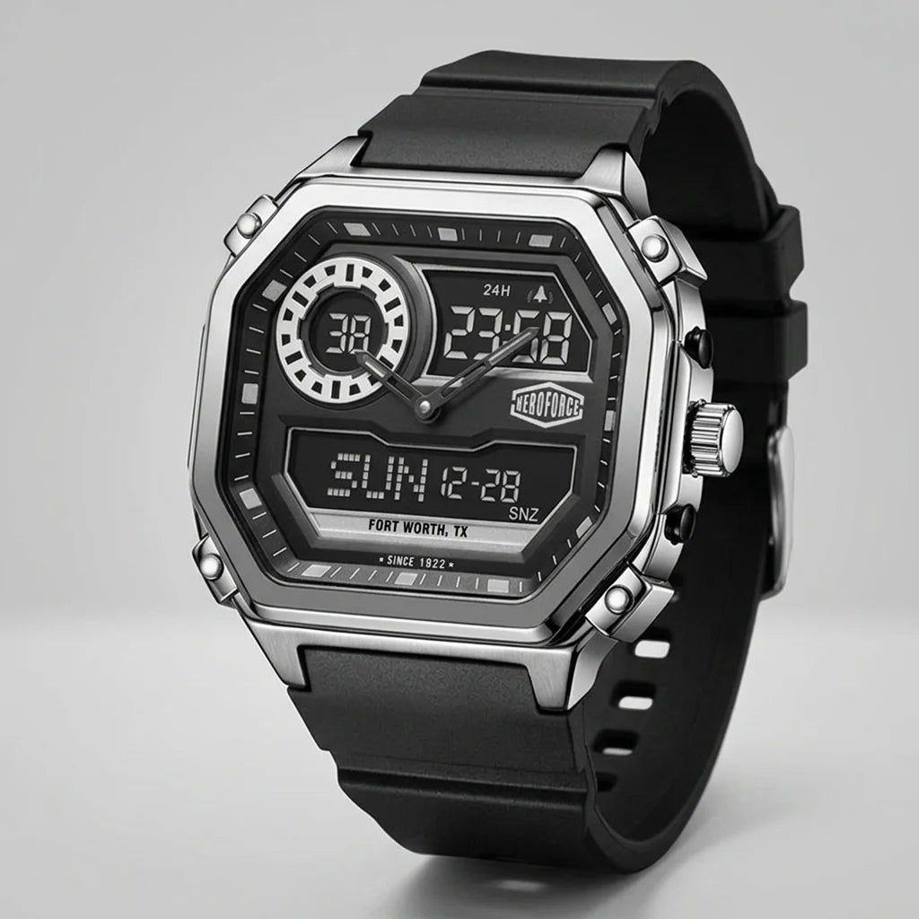 A rugged digital wrist watch with a black rubber strap, a silver-tone metal case, and a black face featuring analog hands, digital displays, and a visible TAG Heuer logo.