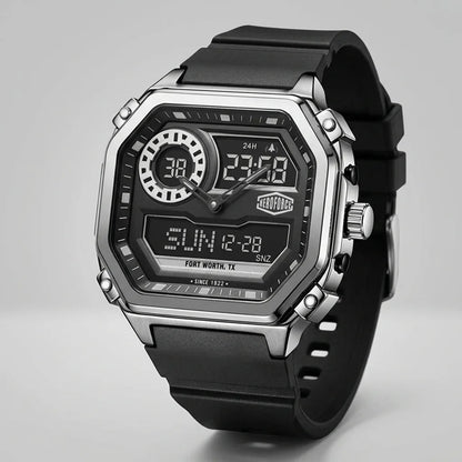 A rugged digital wrist watch with a black rubber strap, a silver-tone metal case, and a black face featuring analog hands, digital displays, and a visible TAG Heuer logo.