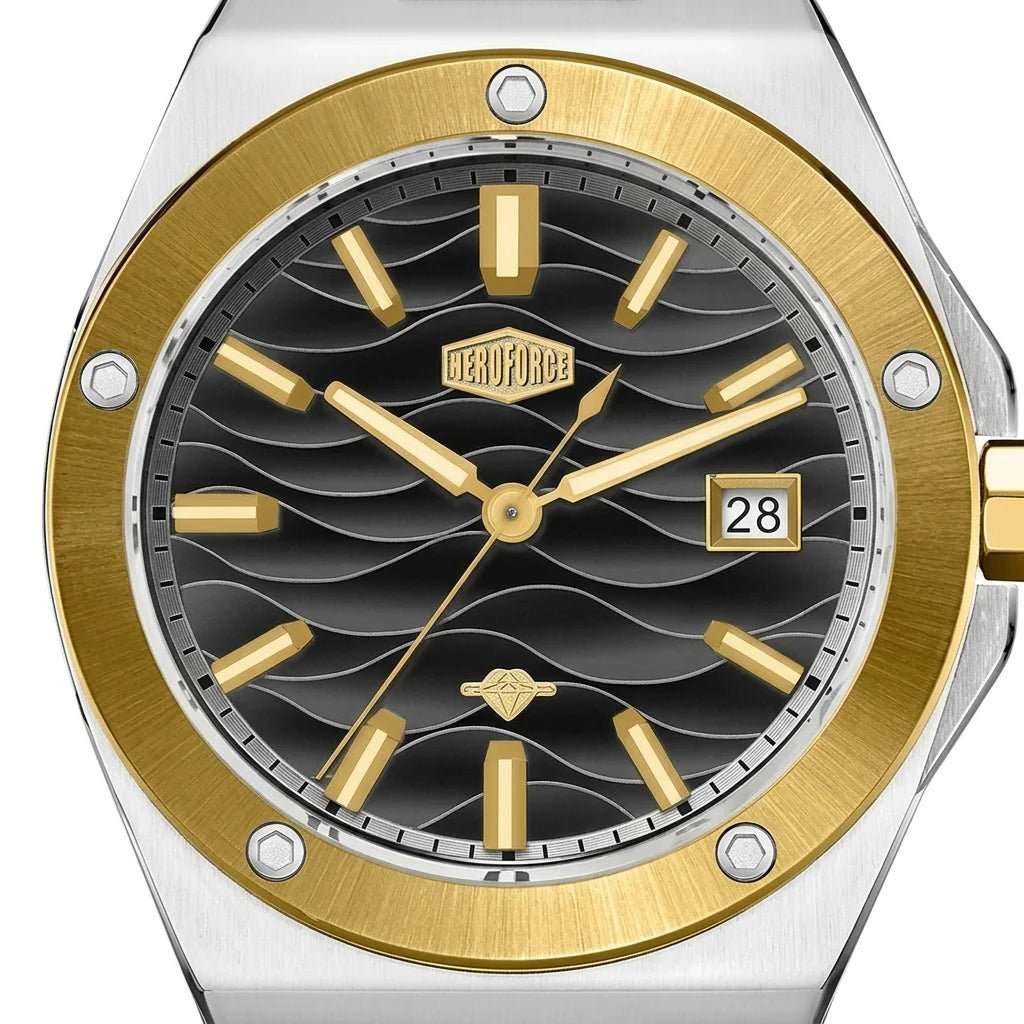 Close up of a black wave patterned watch dial with gold hour markers, gold bezel, and date display.