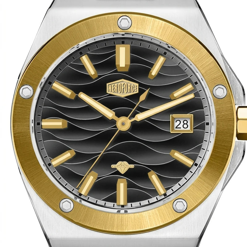 Close up of a black wave patterned watch dial with gold hour markers, gold bezel, and date display.