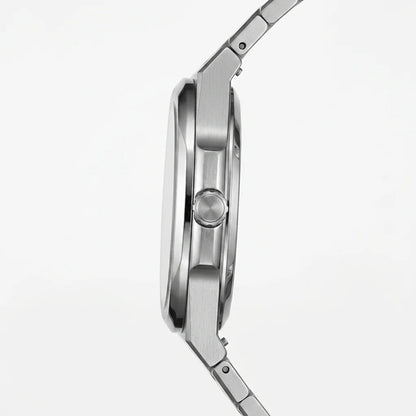 Side profile view - Stainless steel wristwatch with turquoise sunburst dial, silver markers, and small seconds subdial